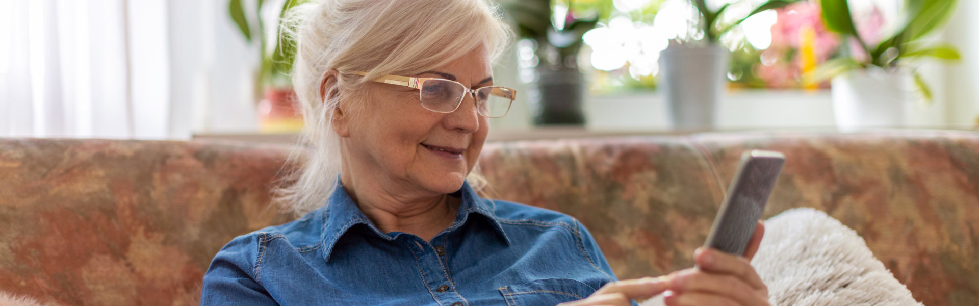 elderly woman using her smartphone